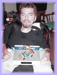  Man with a sip and puff switch and his art work