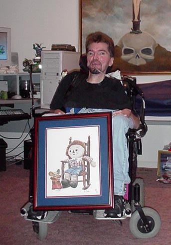 Bo holding more of his art work