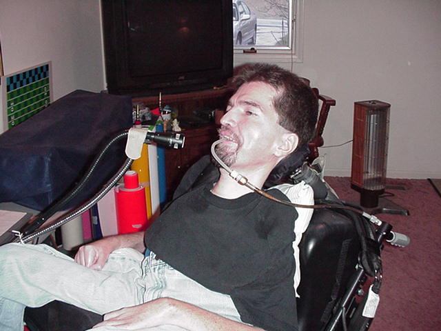 Picture of Bo using a Sip and Puff Switch