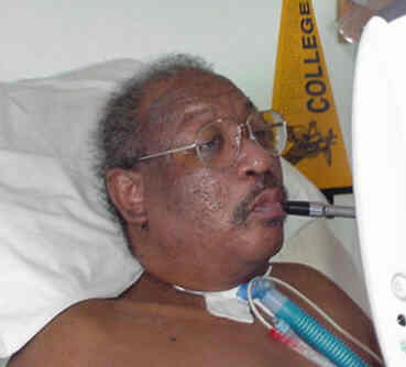 Mr. Scott at computer using a sip and puff switch